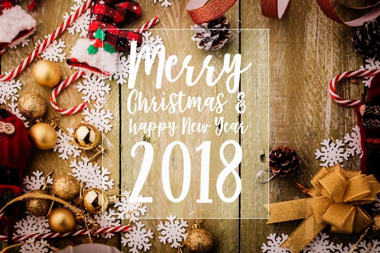 festive background concept with christmas decorating items on wooden background with light filter